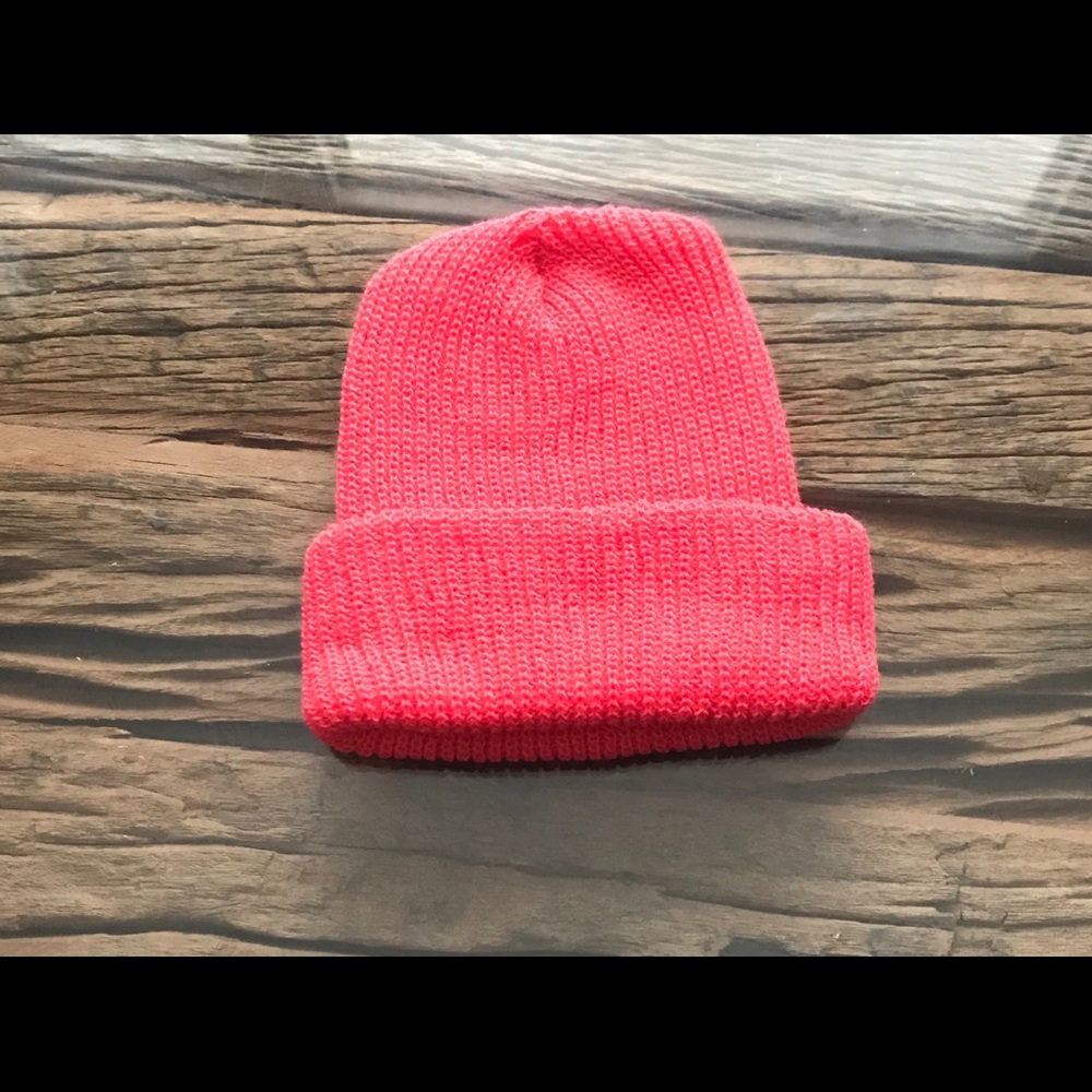 Winter hat. Salmon color. Knitted hat.